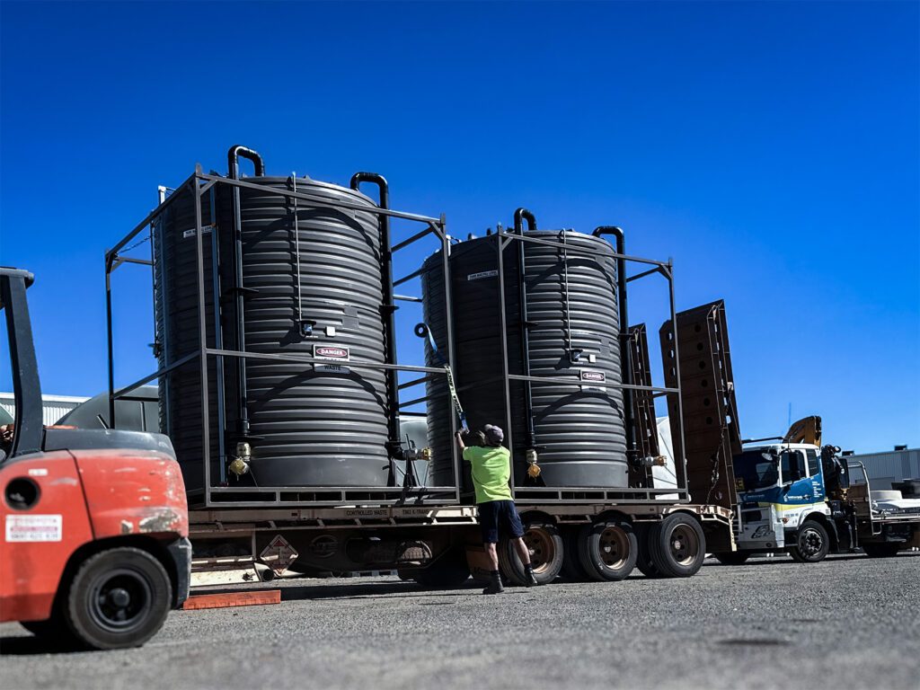 Bunded Portable Sewage Tanks Being Loaded Onto Truck
