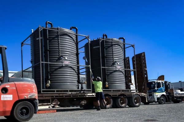 Bunded Portable Sewage Tanks Being Loaded onto truck